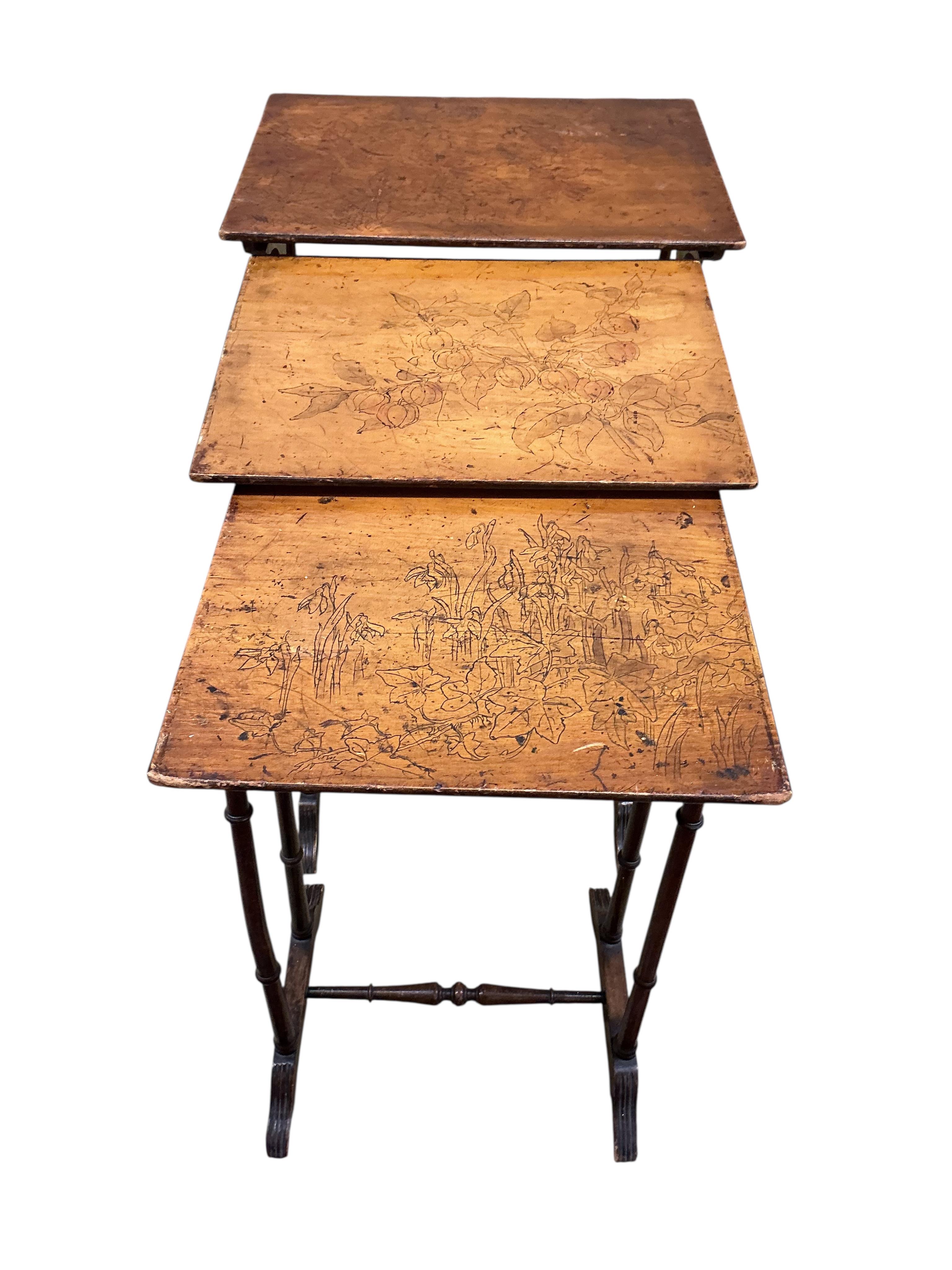 A nest of three beech occasional tables, width 56cm, depth 40cm, height 72cm